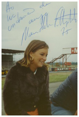 Maria-Helena Fittipaldi sitting on the pitwall