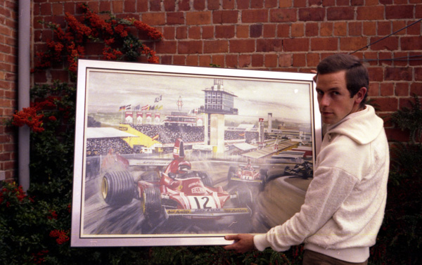 Carlos holding his painting of Niki Lauda