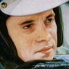 close portrait of Jim Clark wearing his helmet